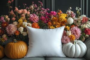 White Pillow Mockup with Autumnal Flowers and Pumpkins photo