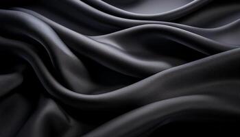 Elegant close-up of smooth black fabric draped in flowing folds, highlighting its soft texture and luxurious appearance. photo