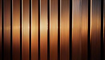 Close-up of vertical metal lines illuminated by warm golden light, creating a modern, industrial, and textured pattern. photo