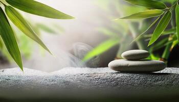 Balanced stones on a textured surface surrounded by fresh bamboo leaves, creating a peaceful and calming Zen atmosphere. photo
