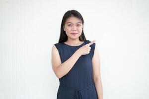 Beautiful Asian Woman wearing formal dress pointing side of copy space, promotion and recommendation concept Isolated On White Background photo