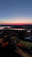 Oslo City Center and Oslo Fjord, Norway at Evening Twilight in Summer. Blue Hour. Aerial Drone Shot. Moving Forward and Upwards. Vertical video