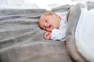 Newborn baby sleep first days of life. Cute little newborn child sleeping peacefully. photo