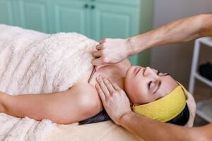 Facial massage with gouache stone in a beauty salon photo