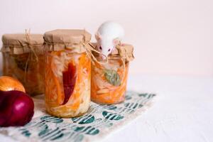 three jars of sauerkraut and carrots in its own juice. traditional home-made, fermented dish of Russia and Germany. photo