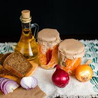 three jars of sauerkraut and carrots in its own juice. traditional home-made, fermented dish of Russia and Germany. photo