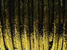 Blurred background of worm gear coated with engine oil and grease,old and rough texture photo