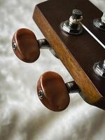 Ukulele headstock with tuning pegs made from wood,use for set up sound, photo