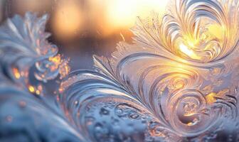 A frosty window pane with a sun shining through it photo