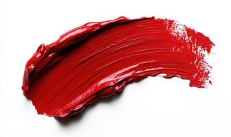 A red lip stain is shown on a white background photo