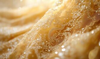 A gold and white fabric with a lot of sparkles on it photo