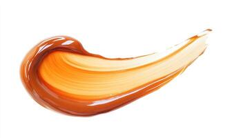 A swirl of orange liquid on a white background photo