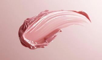 A pink liquid is being sprayed onto a pink background photo