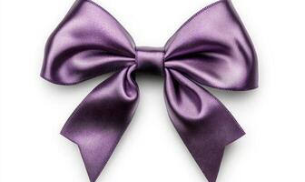 A purple ribbon bow is shown on a white background photo