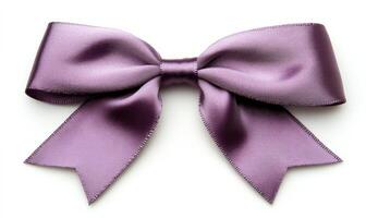 A purple ribbon with a bow is shown on a white background photo