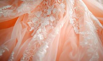 A pink and white lace fabric with flowers on it photo