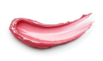 A pink lip gloss is shown in a white background photo