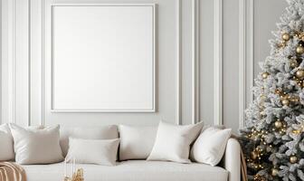 A white couch sits in front of a white wall with a large white picture frame photo