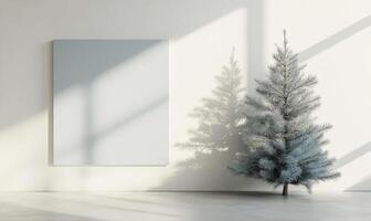 A white wall with a large empty frame and a small tree in the foreground photo