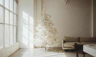 A white Christmas tree stands in a room with a couch and a coffee table photo