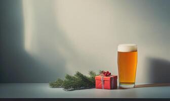 A glass of beer sits next to a red box with a bunch of berries on it photo