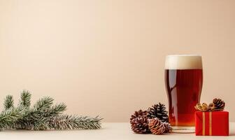 A glass of beer sits on a table next to a pine tree and a red box photo