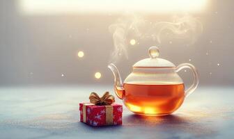 A tea kettle sits on a table next to a red box photo