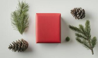 A red box with pine needles on top of it photo