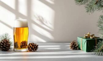 A glass of beer is on a table with pine cones and a green box photo