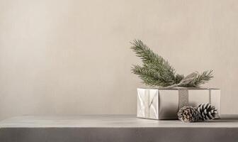 A silver box with a pine tree branch on top of it photo