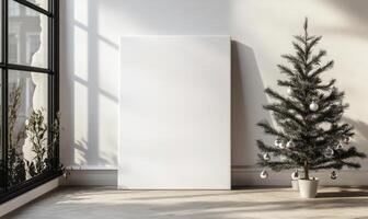 A white frame with a Christmas tree in the background photo