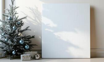 A white framed picture sits in front of a Christmas tree photo
