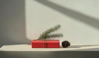 A red book with a pine branch on top of it photo