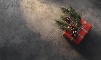 A red box with pine cones on top of it photo