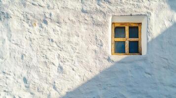 A Single Window on a Whitewashed Wall photo