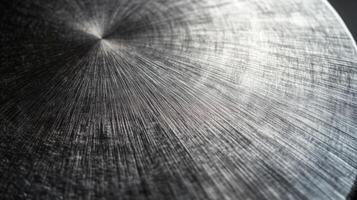 Close-up of a Circular Metal Surface with a Radiating Pattern photo