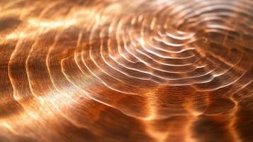 Close-up of a Shiny Copper Surface with Circular Patterns photo