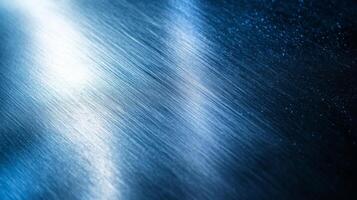Blue Metallic Surface with Diagonal Lines and Light Reflection photo
