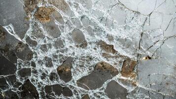 Abstract pattern of shattered glass with a gray background. photo