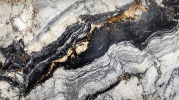 Black, Grey, and Gold Swirling Marble Texture photo