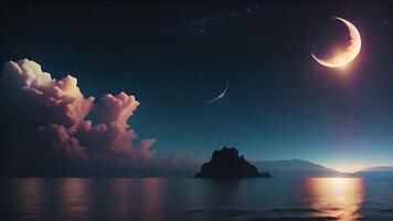 A mesmerizing night sky with a glowing crescent moon, wispy clouds, and twinkling stars creates a magical atmosphere over a tranquil sea. video