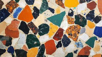 Abstract Pattern of Multicolored Stone Chips in Concrete photo