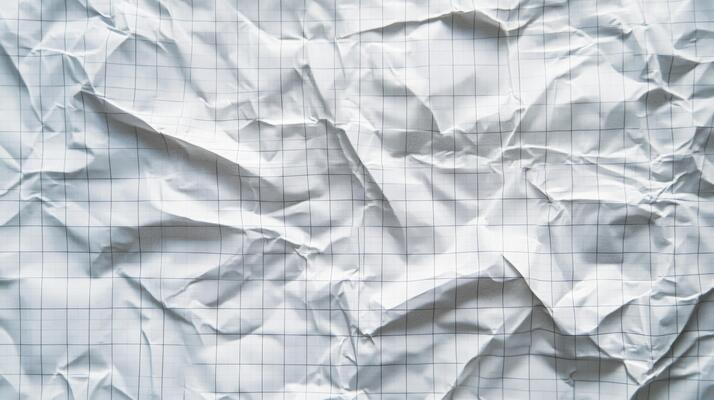 Crumpled White Paper with a Grid Pattern