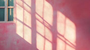 Window Light Casting a Grid Pattern on a Pink Wall photo