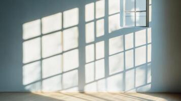 Sunlight streaming through a window casting a grid-like shadow on a white wall photo