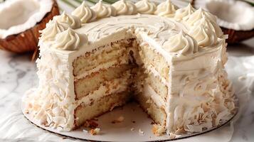 Classic coconut cream cake with coconut cream cheese frosting cut out on an isolated simple minimalist background photo