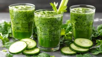 Glass of invigorating cucumber spinach and celery juice with cucumber spinach and celery garnish cut out on an isolated simple minimalist background photo
