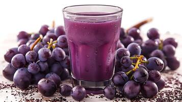 Glass of Tangy Grape Juice Grape Clusters A refreshing glass of grape juice enhanced by clusters of fresh grapes for a burst of flavor photo