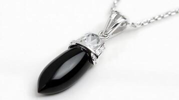 Elegant obsidian and quartz pendant with a deep black obsidian stone and a clear quartz set in a minimalist silver chain photo