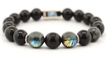 Elegant obsidian and labradorite bracelet with deep black obsidian and shimmering bluegreen labradorite stones in a sleek design photo